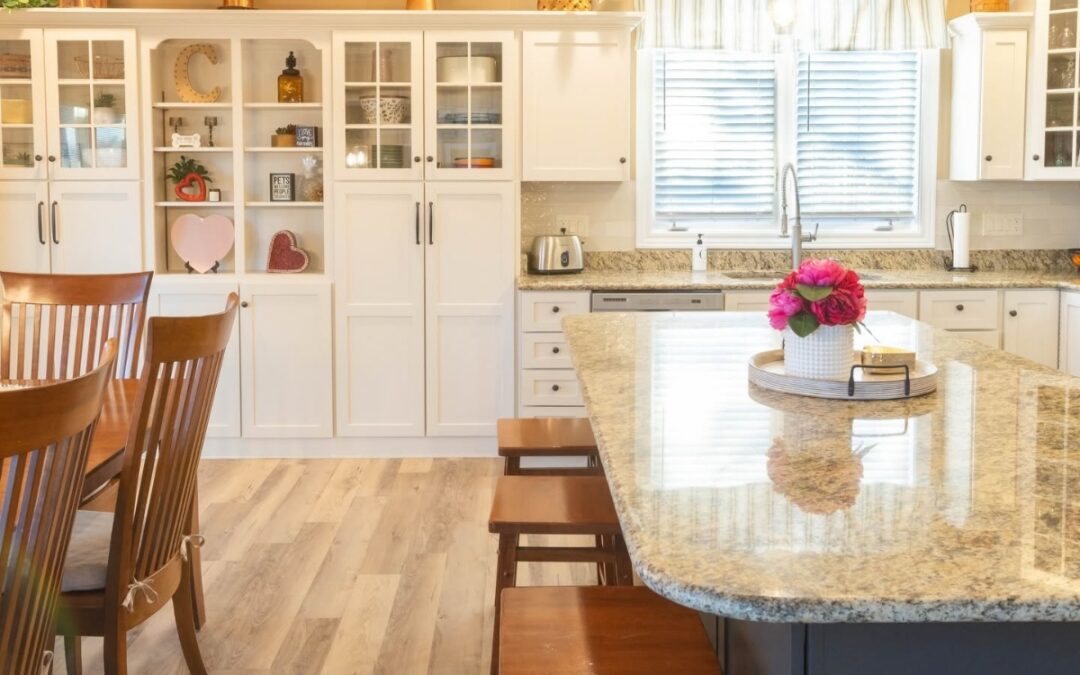 Custom kitchen renovation with built-in cabinetry, large island, and warm finishes by Shawluxe